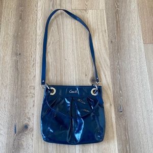 Coach navy purse. Can be worn crossbody or Hobo. Measures 13.5” X 11”.